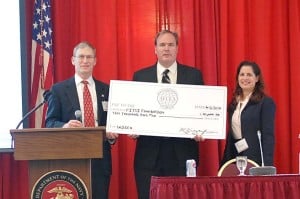 Presentation of $10,000 Scholarship to Mr. Jim Wiggins for Wounded Warrior Cyber Combat Academy