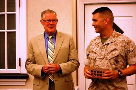 Comm School CO, Col (sel) Mike Phillips presents a brick from Edson Hall to LtGen Bob Shea, USMC (ret)
